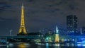 The small Statue of Liberty located near the Eiffel tower night timelapse. Paris, France Royalty Free Stock Photo