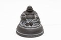 Small statue of a smiling buddha Royalty Free Stock Photo