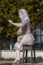 Small statue of a working lady on Portimao city