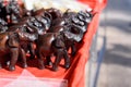 Small statues of elephants on the red table