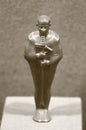 A small statuette of the god Ptah. Culture of Ancient Egypt. Black and white photo, sepia Royalty Free Stock Photo