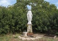 Small stature of the Virgin Mary in a park in Alberobello, Italy