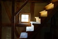 Small steps of wooden stairwell in historic half-timbered house