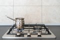 Modern kitchen gas stove cooker with metal burner on countertop Royalty Free Stock Photo