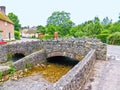 Small stone arch bridge at entry to small English village Royalty Free Stock Photo