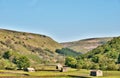 Small stone barns on farmland