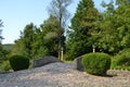 Small stone bridge with bushes Royalty Free Stock Photo