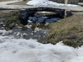 A small stone bridge over a stream Royalty Free Stock Photo