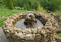Small stone fountain on top of hill, looking down Royalty Free Stock Photo