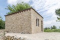 A small stone house under blue sky Royalty Free Stock Photo