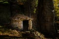 Small stone hut in the middle of a forest Royalty Free Stock Photo