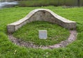 Small stone memorial of Ila Bunk, a dedicated employee of the City of Dallas, located near Turtle Creek.