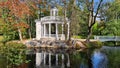 Small stone pavilion for relaxing on banks of canal in the Latvian city park Kemeri in first days of autumn 2022