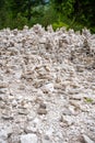 Small stone pyramides near alpine lake Braies or Pragser Wildsee, Dolomites Alps, Italy. Royalty Free Stock Photo
