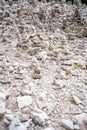 Small stone pyramides near alpine lake Braies or Pragser Wildsee, Dolomites Alps, Italy. Royalty Free Stock Photo