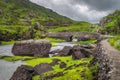 Small stone Wishing Bridge over winding stream in Gap of Dunloe