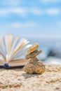 Small stones on the background of an open book Royalty Free Stock Photo