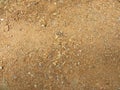 Small stones on beige color ground background Royalty Free Stock Photo