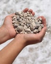 Small stones in hands Royalty Free Stock Photo