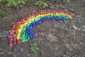 Small stones painted in rainbow colors