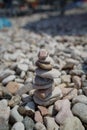 Small stones staked as a tower at a lake