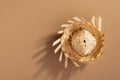 Small straw hat used for festa junina ornaments on brown background