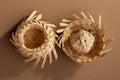 Small straw hats used for festa junina ornaments on brown background