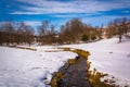 Small stream through a snow covered farm field in rural Carroll Royalty Free Stock Photo