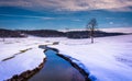 Small stream through a snow covered farm field in rural Carroll Royalty Free Stock Photo