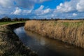 A small stream winds its way through the English countryside