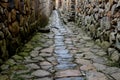 Small street extend, with stone wall and road