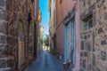 Small street at Agde Centre with old Buildings on a sunny day Royalty Free Stock Photo