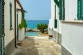 Small street in town Pizzo leading to the beach on tyrrhenian sea, Calabria, Italy Royalty Free Stock Photo