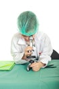 Small student looking into microscope
