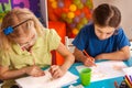 Small students children painting in art school class. Royalty Free Stock Photo