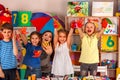 Small students girl finger painting in art school class. Royalty Free Stock Photo