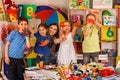 Small students girl finger painting in art school class. Royalty Free Stock Photo