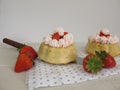 Small stuffed strawberry cakes with whipped cream Royalty Free Stock Photo