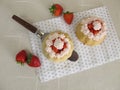 Small stuffed strawberry cakes with whipped cream Royalty Free Stock Photo