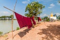 Small stupa and laundry at Kyaut Ka Lat (Kyaut Kalat or Kyauk Kalap) temple near Hpa An, Myanm