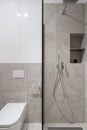 Small and stylish bathroom with shower and patterned tiles