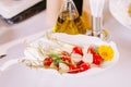 Small stylish snacks on studs. A snack of cheese cubes and little cherry tomatoes Royalty Free Stock Photo