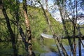 small suspension footbridge over a small river in norway