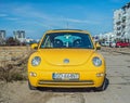 Old classic yellow Volkswagen New Beetle front view Royalty Free Stock Photo