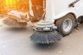 Small sweeper machine standing at parking storage after cleaning city park alley.Sweeping vacuum cleaner vehicle removing dust and Royalty Free Stock Photo