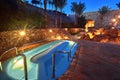 Small swimming pool illuminated at night