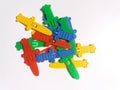 Small sword-shaped toys of various colors with a white background