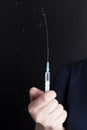 a small syringe in the hand of a person Royalty Free Stock Photo