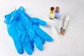 A small syringe, medicine and doctor& x27;s hands in gloves. Utensils necessary for treatment at the clinic Royalty Free Stock Photo