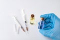 A small syringe, medicine and doctor& x27;s hands in gloves. Utensils necessary for treatment at the clinic Royalty Free Stock Photo